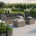 Salon exterieur en polyrotin avec canape trois places, table, tabouret et coussins pour quatre personnes