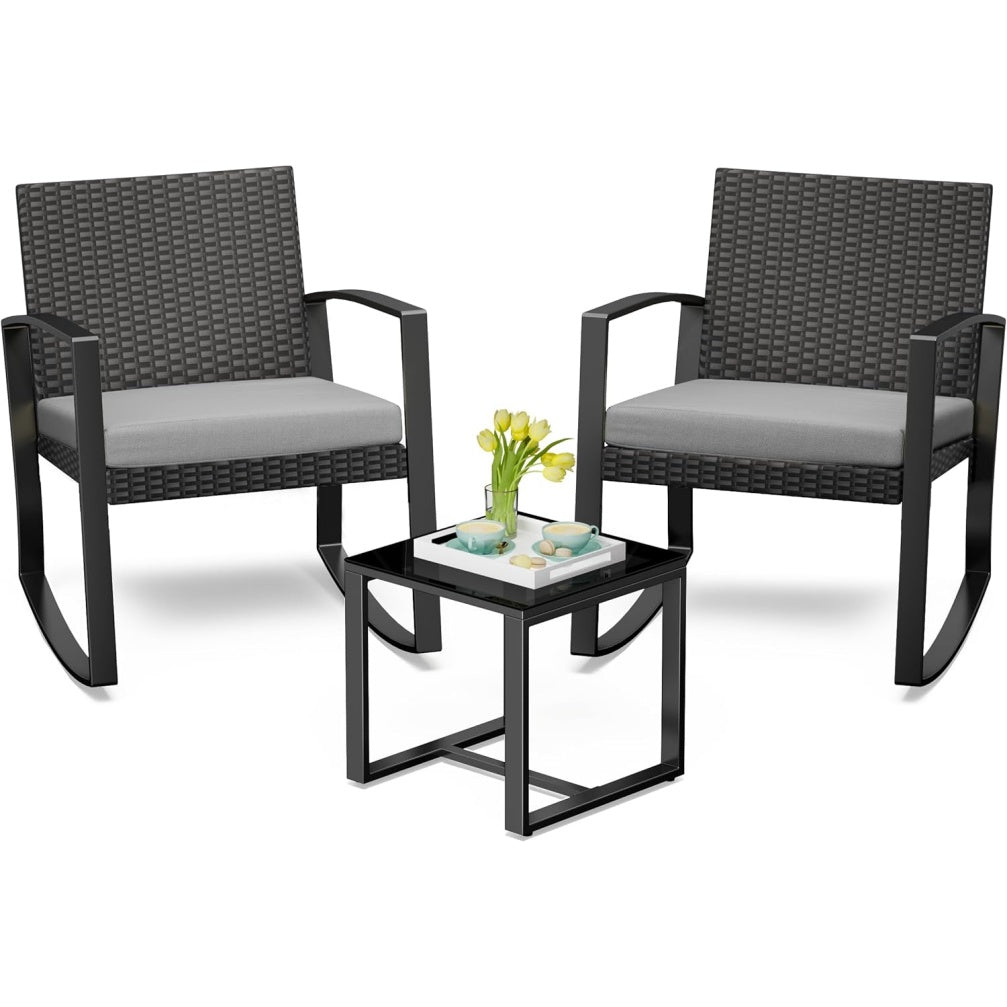 Salon de jardin trois pieces avec deux fauteuils a bascule, table basse et coussins en resine tressee grise