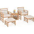 Salon de jardin cinq pieces en resine tressee avec fauteuils, ottomans, coussins epais et table basse